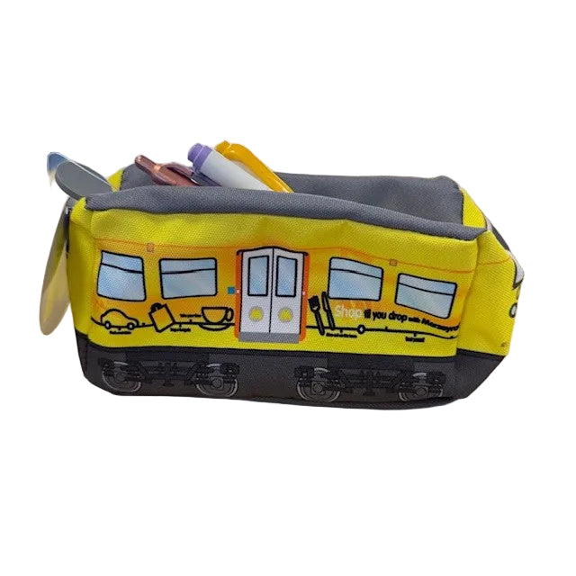 Yellow Merseyrail 508 train-shaped pencil case with printed windows and doors, grey roof and base, and stationary visible inside.