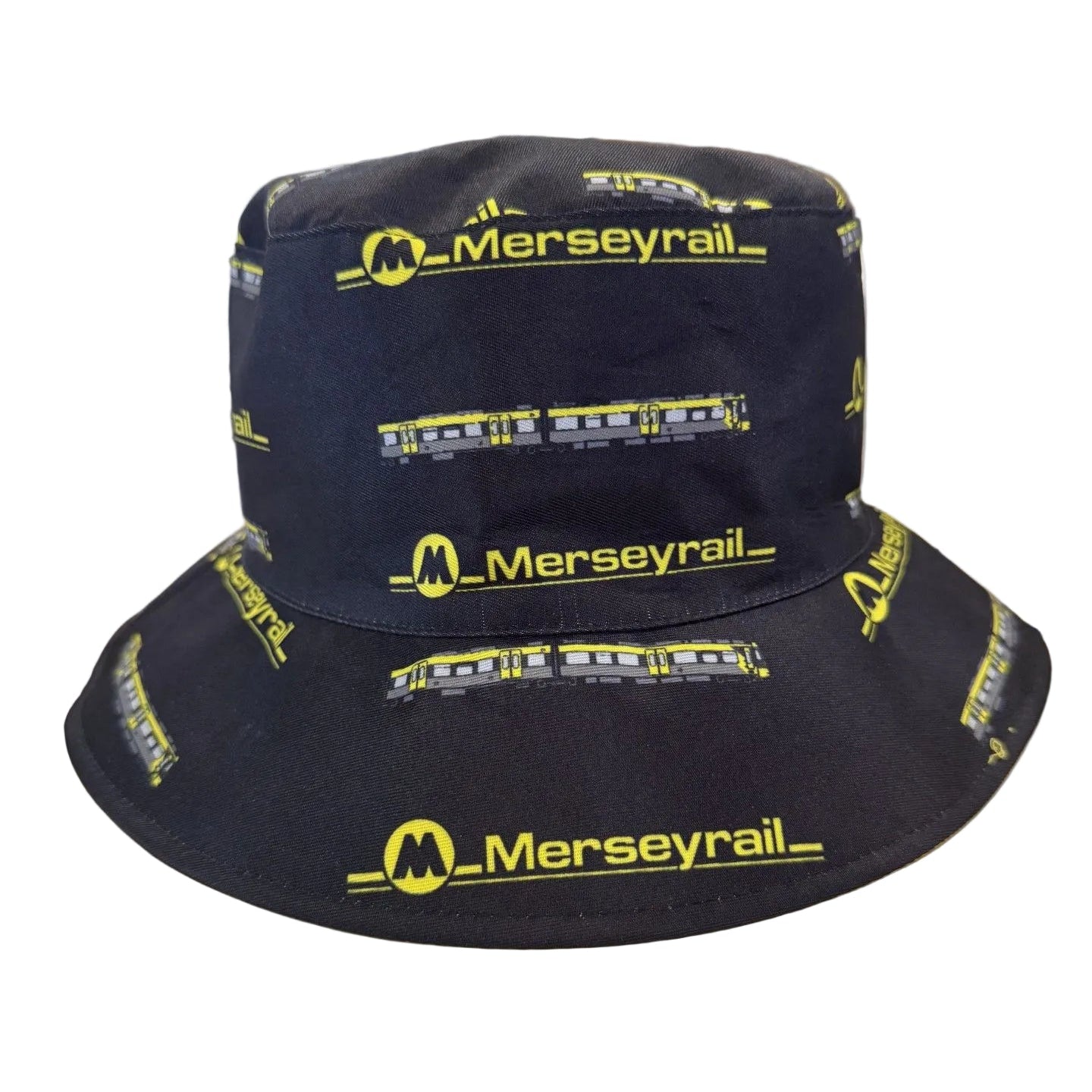 A black bucket hat printed with yellow 'Merseyrail' logos and train illustrations, displayed on a white background.